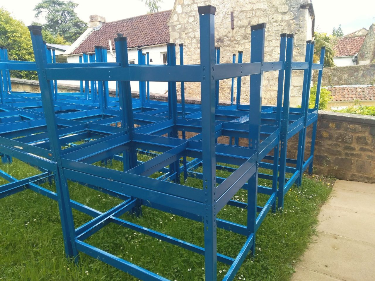Untitled, painted metal bench frames, grass, dimensions variable, 2019 NFS