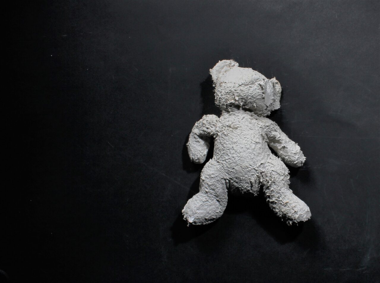 Parva relicta teddy, clay slip, charity shop toy, l 24 x w 14 x h 6 cm, 2022 POA teddy, clay slip, charity shop toy, l 24 x w 14 x h 6 cm, 2022 POA