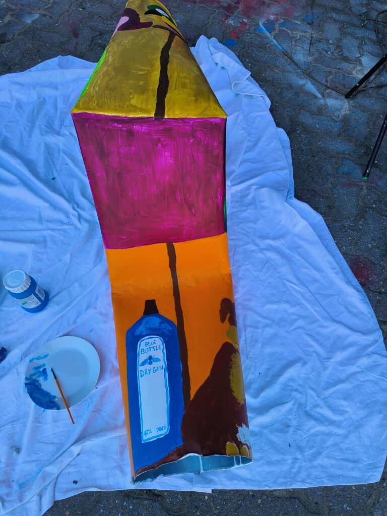 Underneath! Bottle of gin tucked away.